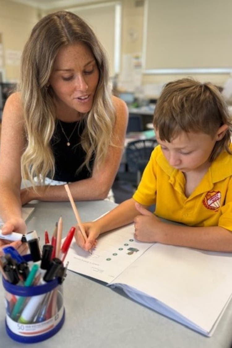 Teacher working one on one with student