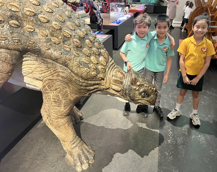 Three stage 1 students at the Australian Museum excursion