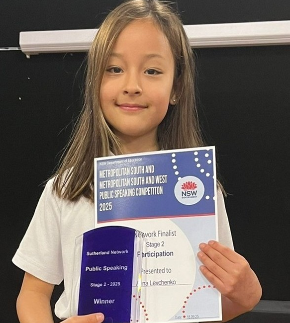 Miranda North student holding Metropolitan South Public Speaking first place trophy